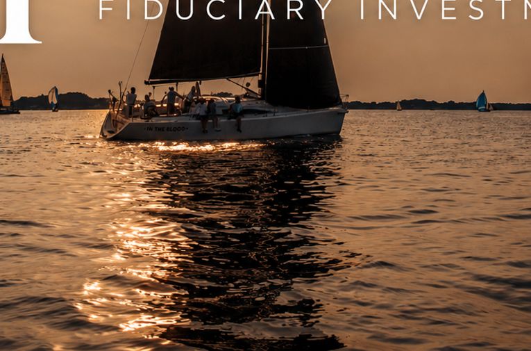 Sailboats on the water at dusk